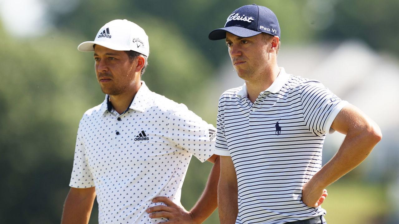 CROMWELL, CONNECTICUT - JUNE 26: Xander Schauffele and Justin Thomas of the United States stand on the second green during the second round of the Travelers Championship at TPC River Highlands on June 26, 2020 in Cromwell, Connecticut.