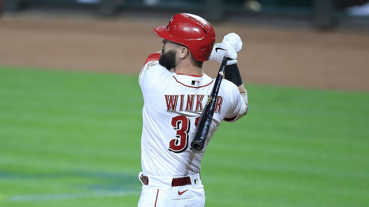 CINCINNATI, OHIO - SEPTEMBER 18: Jesse Winker #33 of the Cincinnati Reds hits a three run home in the third inning against the Chicago White Sox at Great American Ball Park on September 18, 2020 in Cincinnati, Ohio.