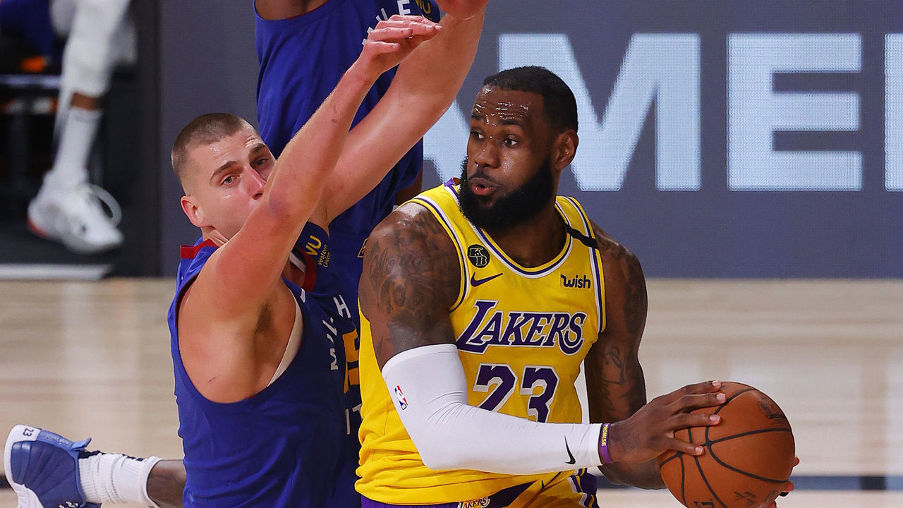 LAKE BUENA VISTA, FLORIDA - SEPTEMBER 18: LeBron James #23 of the Los Angeles Lakers is pressured by Nikola Jokic #15 of the Denver Nuggets during the third quarter in Game One of the Western Conference Finals during the 2020 NBA Playoffs at AdventHealth Arena at the ESPN Wide World Of Sports Complex on September 18, 2020 in Lake Buena Vista, Florida.