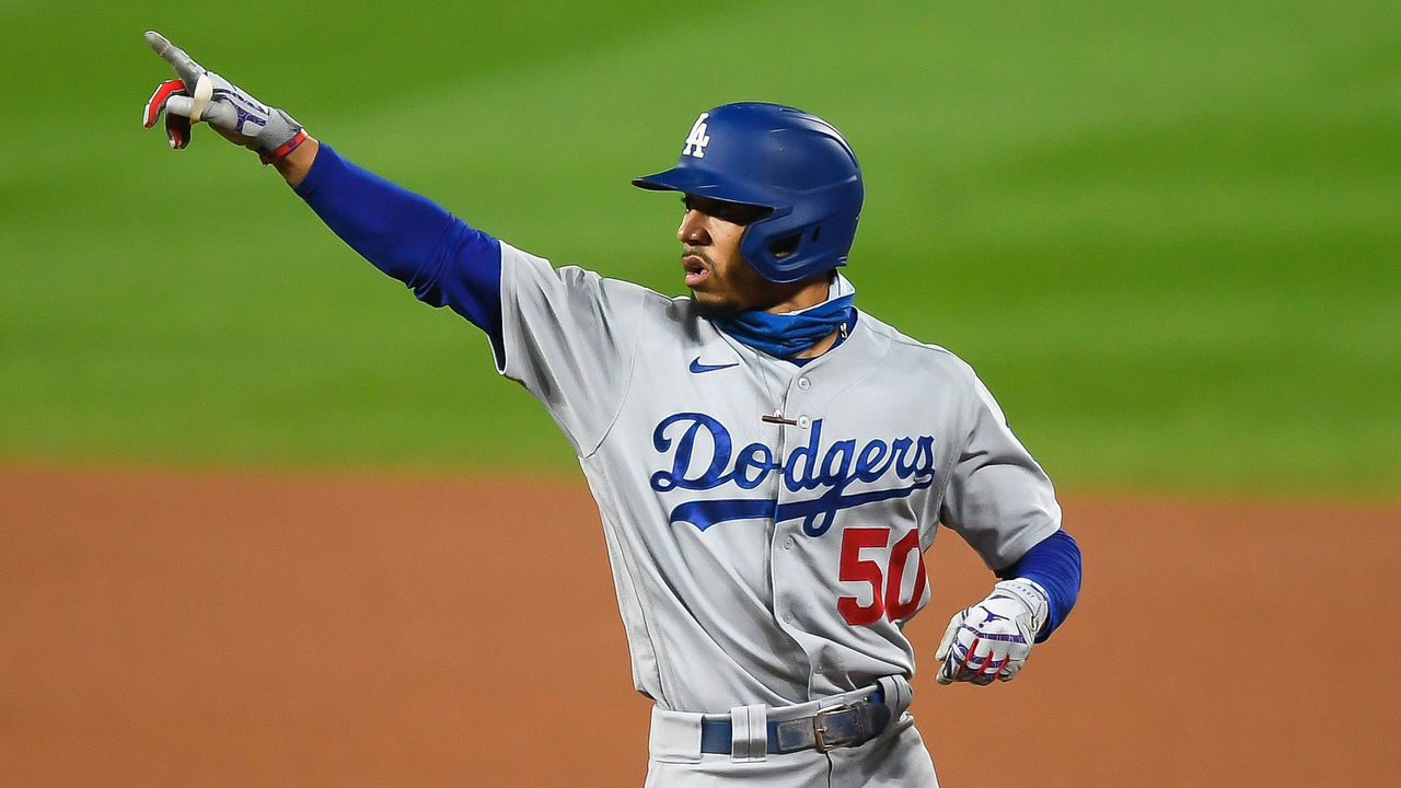 DENVER, CO - SEPTEMBER 17: Los Angeles Dodgers right fielder Mookie Betts (50) points to the dugout to celebrate a seventh inning RBI single against the Colorado Rockies during a game at Coors Field in Denver, Colorado on September 17, 2020.