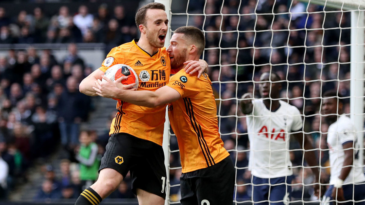 Wolverhampton Wanderers' Diogo Jota (left) celebrates scoring his side's second goal of the game with team-mate Matt Doherty during the Premier League match at the Tottenham Hotspur Stadium, London.
