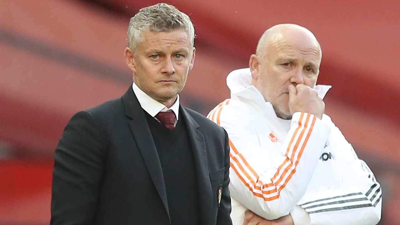 Manchester United's Norwegian manager Ole Gunnar Solskjaer (L) and Manchester United's English first-team coach Mike Phelan (R) watch from the touchline during the English Premier League football match between Manchester United and Crystal Palace at Old Trafford in Manchester, north west England, on September 19, 2020.