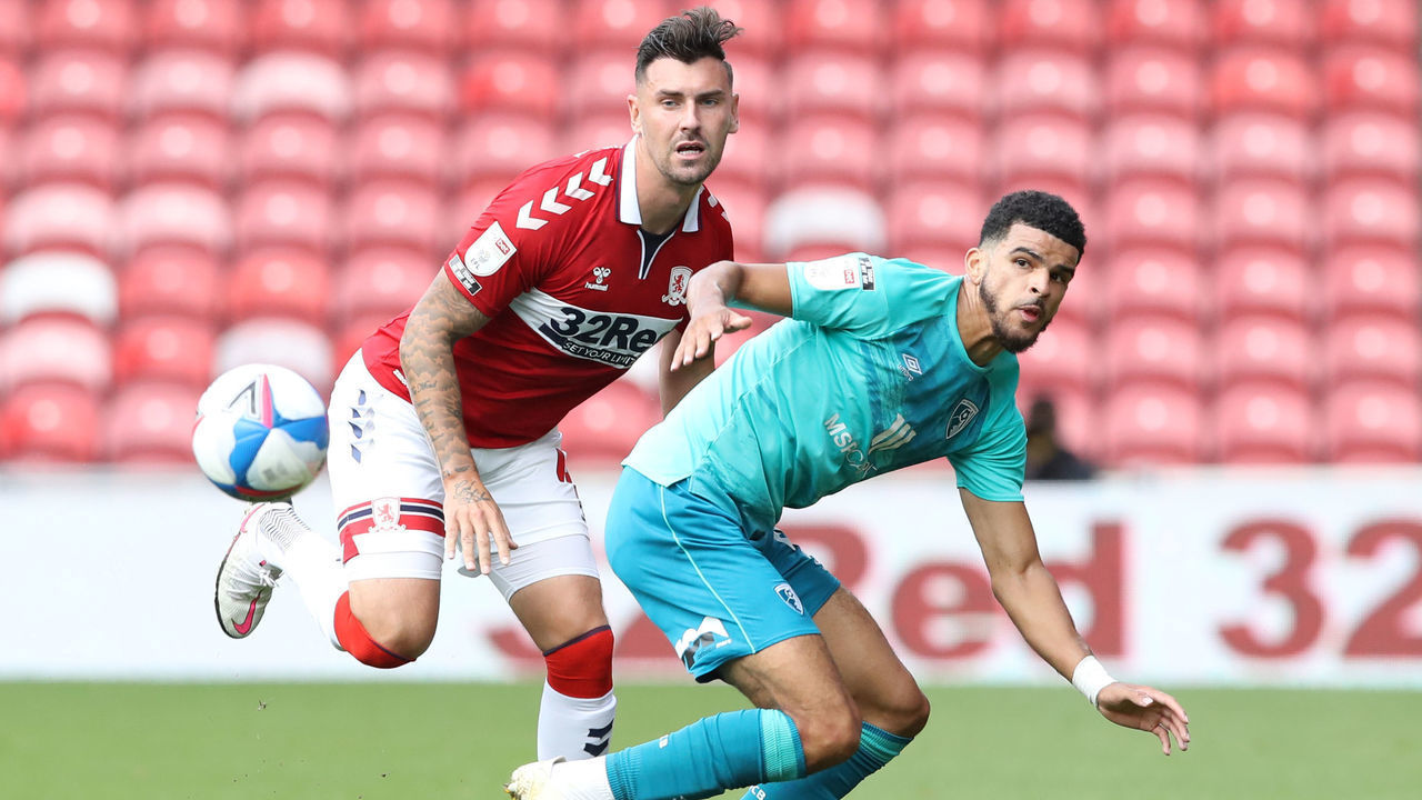 AFC Bournemouth's Dominic Solanke (right) and Middlesbrough's Grant Hall battle for the ball during the Sky Bet Championship match at the Riverside Stadium, Middlesbrough.