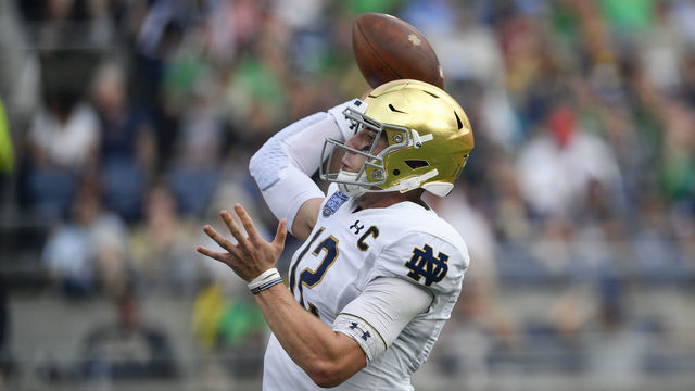 ORLANDO, FL - DECEMBER 28: Notre Dame Fighting Irish quarterback Ian Book (12) throws a pass during the second half of the Camping World Bowl between the Notre Dame Fighting Irish and the Iowa State Cyclones on December 28, 2019, at Camping World Stadium in Orlando, FL.