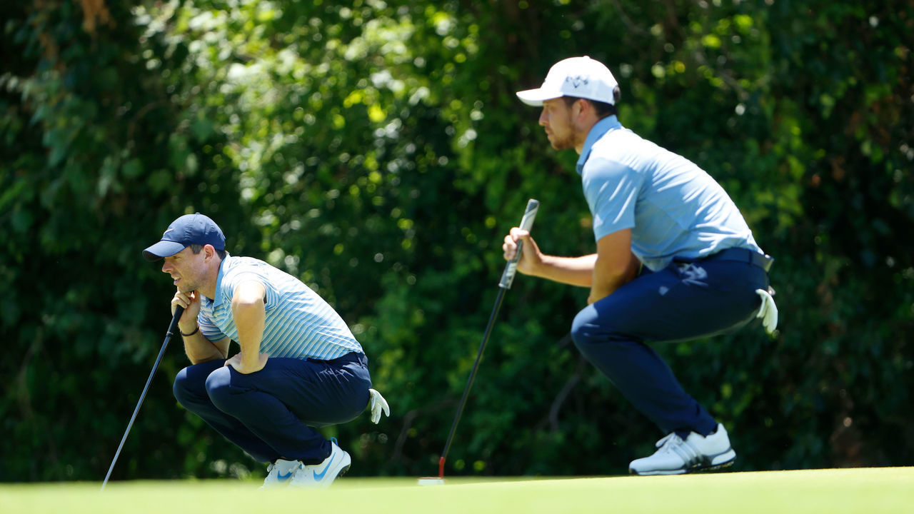 FORT WORTH, TEXAS - JUNE 13: Rory McIlroy of Northern Ireland and Xander Schauffele of the United States look on over the seventh green during the third round of the Charles Schwab Challenge on June 13, 2020 at Colonial Country Club in Fort Worth, Texas.