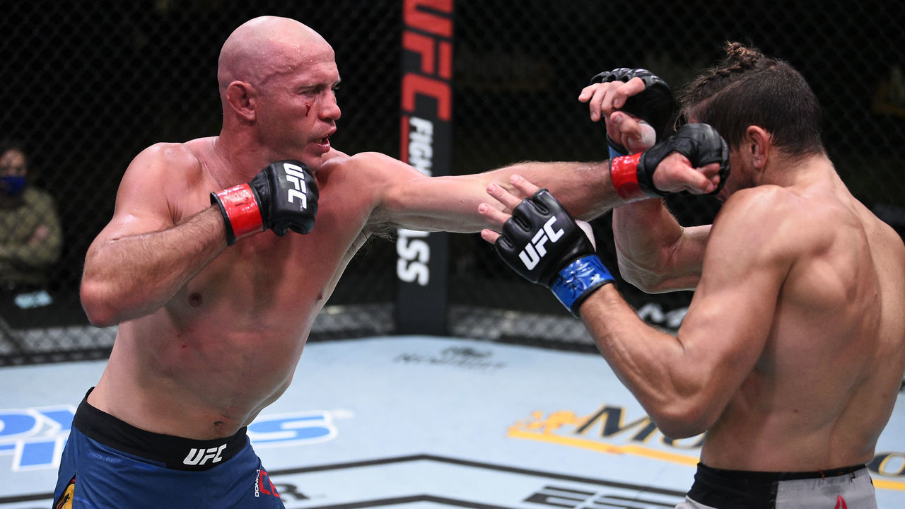 LAS VEGAS, NEVADA - SEPTEMBER 19: (L-R) Donald Cerrone punches Niko Price in their welterweight bout during the UFC Fight Night event at UFC APEX on September 19, 2020 in Las Vegas, Nevada.