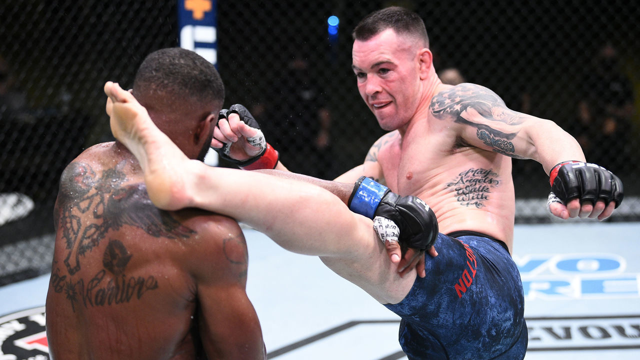 LAS VEGAS, NEVADA - SEPTEMBER 19: (R-L) Colby Covington kicks Tyron Woodley in their welterweight bout during the UFC Fight Night event at UFC APEX on September 19, 2020 in Las Vegas, Nevada.