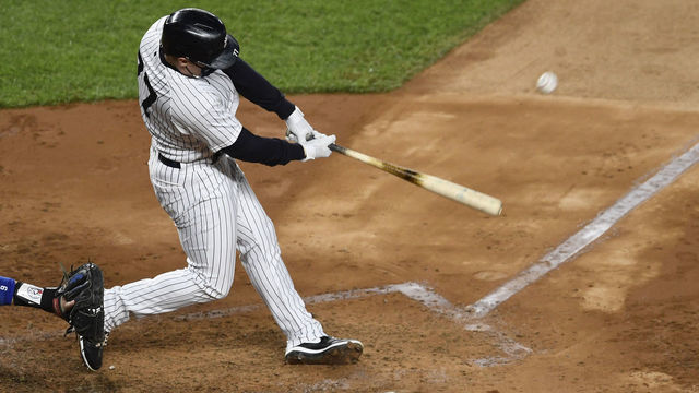 NEW YORK, NEW YORK - SEPTEMBER 16: Clint Frazier #77 of the New York Yankees hits a home run during the fourth inning against the Toronto Blue Jays at Yankee Stadium on September 16, 2020 in the Bronx borough of New York City.