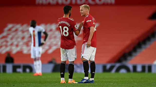 MANCHESTER, ENGLAND - SEPTEMBER 19: Donny Van De Beek of Manchester United speaks with Bruno Fernandes of Manchester United during the Premier League match between Manchester United and Crystal Palace at Old Trafford on September 19, 2020 in Manchester, England.