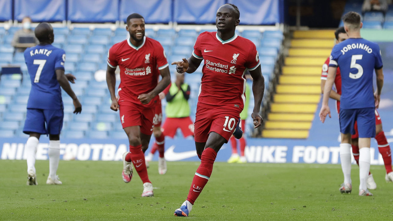 Liverpool's Senegalese striker Sadio Mane (C) celebrates after scoring during the English Premier League football match between Chelsea and Liverpool at Stamford Bridge in London on September 20, 2020.