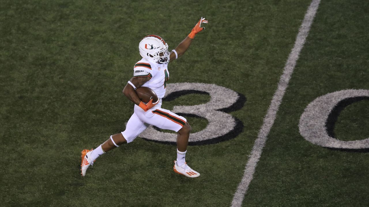 LOUISVILLE, KENTUCKY - SEPTEMBER 19: Jaylan Knighton #4 of the Miami Hurricanes runs for a touchdown in the third quarter against the Louisville Cardinals at Cardinal Stadium on September 19, 2020 in Louisville, Kentucky.