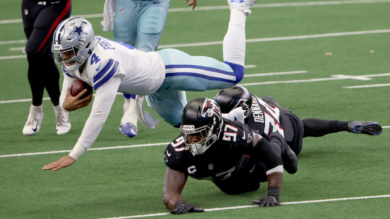ARLINGTON, TEXAS - SEPTEMBER 20: Dak Prescott #4 of the Dallas Cowboys carries the ball against Grady Jarrett #97 of the Atlanta Falcons and Darqueze Dennard #34 of the Atlanta Falcons inn the second quarter and at AT&T Stadium on September 20, 2020 in Arlington, Texas.