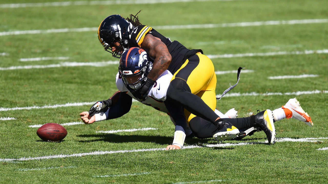 PITTSBURGH, PA - SEPTEMBER 20: Bud Dupree #48 of the Pittsburgh Steelers forces a fumble after hitting Drew Lock #3 of the Denver Broncos during the first quarter at Heinz Field on September 20, 2020 in Pittsburgh, Pennsylvania.