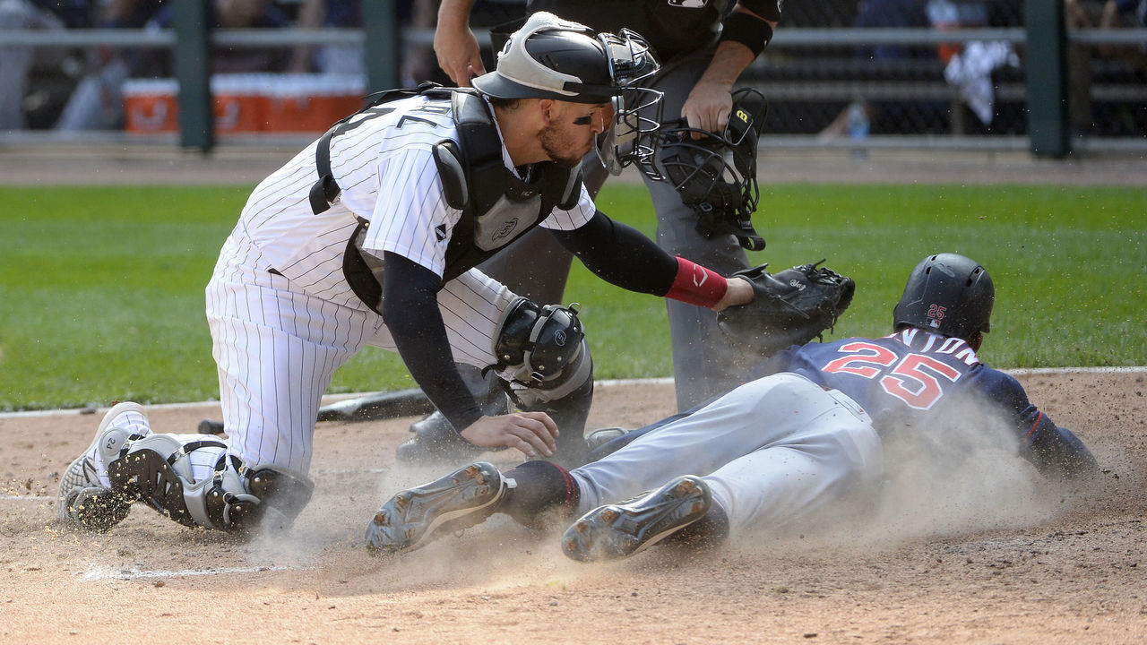 CHICAGO - SEPTEMBER 17: Yasmani Grandal #24 of the Chicago White Sox tags out Byron Buxton #25 of the Minnesota Twins in the seventh inning on September 17, 2020 at Guaranteed Rate Field in Chicago, Illinois.