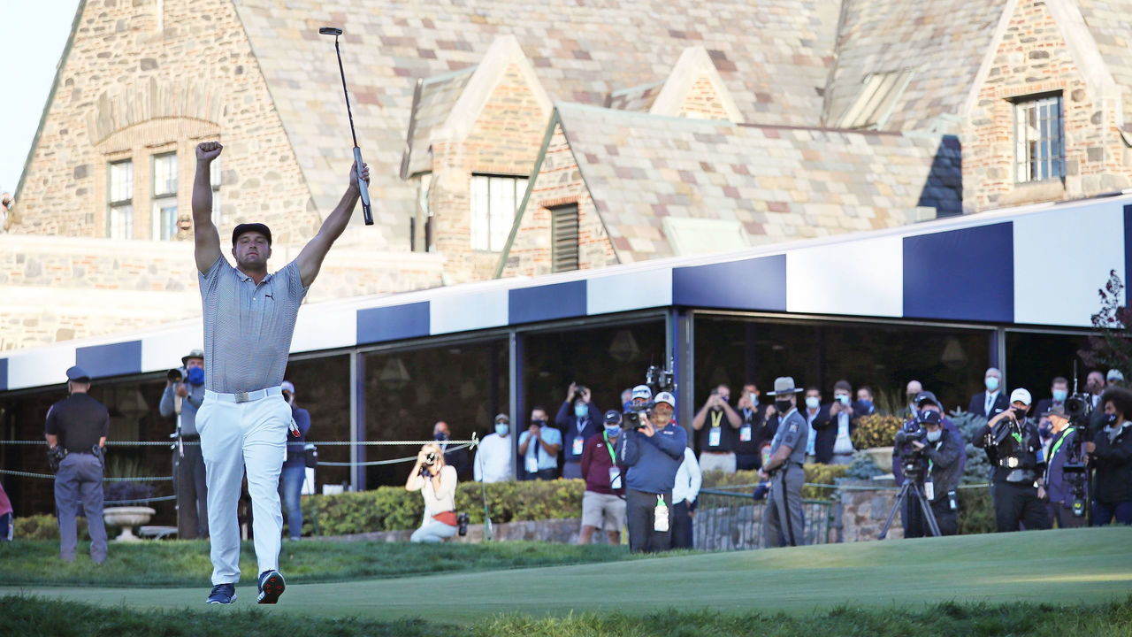 MAMARONECK, NEW YORK - SEPTEMBER 20: Bryson DeChambeau of the United States celebrates on the 18th green after winning during the final round of the 120th U.S. Open Championship on September 19, 2020 at Winged Foot Golf Club in Mamaroneck, New York.