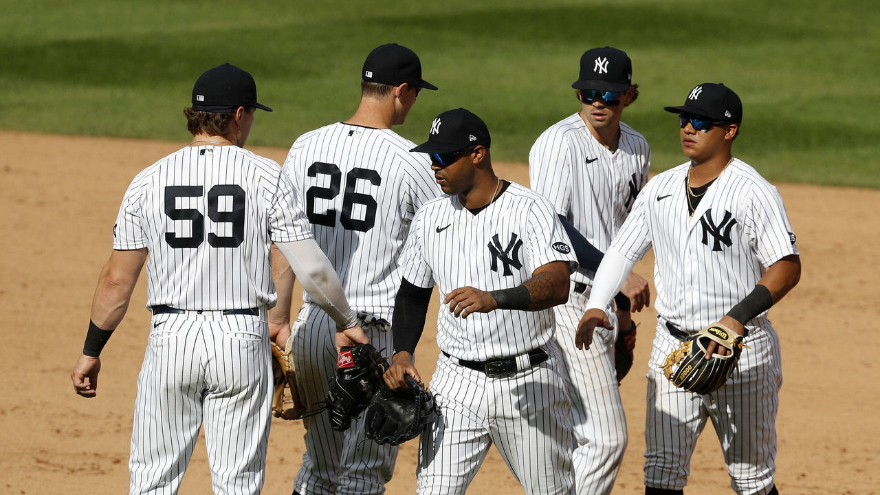 NEW YORK, NEW YORK - SEPTEMBER 13: (L-R) Luke Voit #59, DJ LeMahieu #26, Aaron Hicks #31, Tyler Wade #14 and Thairo Estrada #71 of the New York Yankees celebrate after defeating the Baltimore Orioles at Yankee Stadium on September 13, 2020 in New York City.