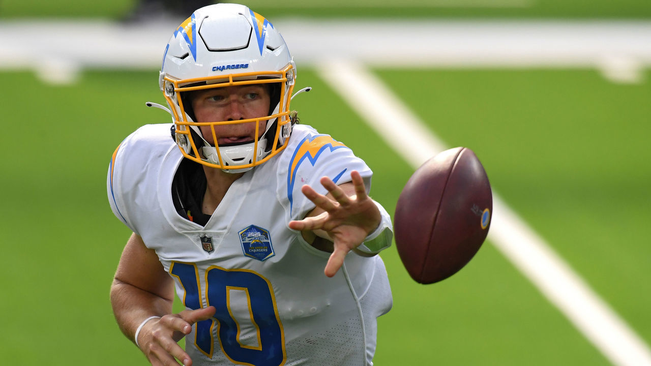 INGLEWOOD, CALIFORNIA - SEPTEMBER 20: Quarterback Justin Herbert #10 of the Los Angeles Chargers pitches back the ball against the Kansas City Chiefs during the second half at SoFi Stadium on September 20, 2020 in Inglewood, California.