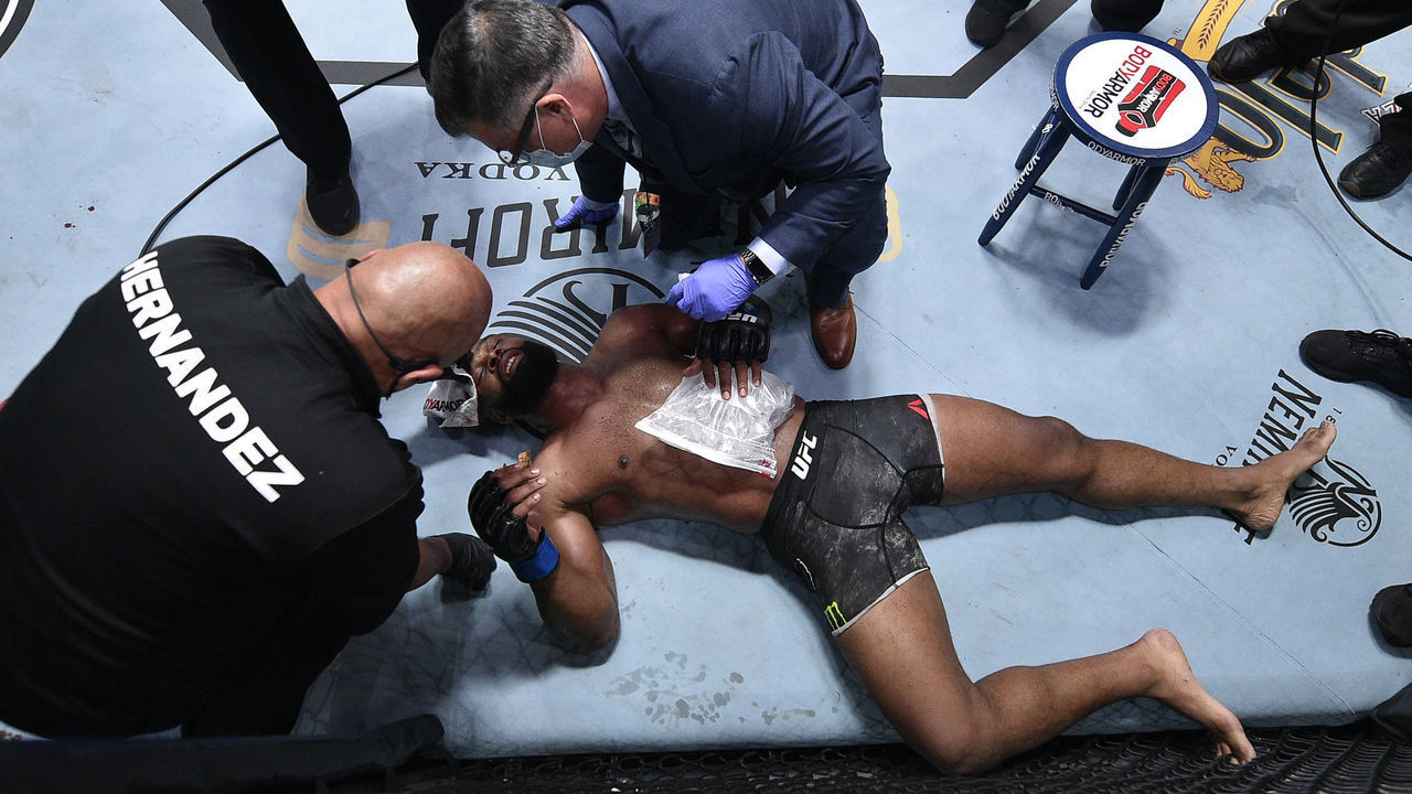 LAS VEGAS, NEVADA - SEPTEMBER 19: Tyron Woodley receives treatment after suffering a rib injury against Colby Covington in their welterweight bout during the UFC Fight Night event at UFC APEX on September 19, 2020 in Las Vegas, Nevada.