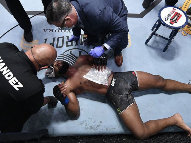 LAS VEGAS, NEVADA - SEPTEMBER 19: Tyron Woodley receives treatment after suffering a rib injury against Colby Covington in their welterweight bout during the UFC Fight Night event at UFC APEX on September 19, 2020 in Las Vegas, Nevada.