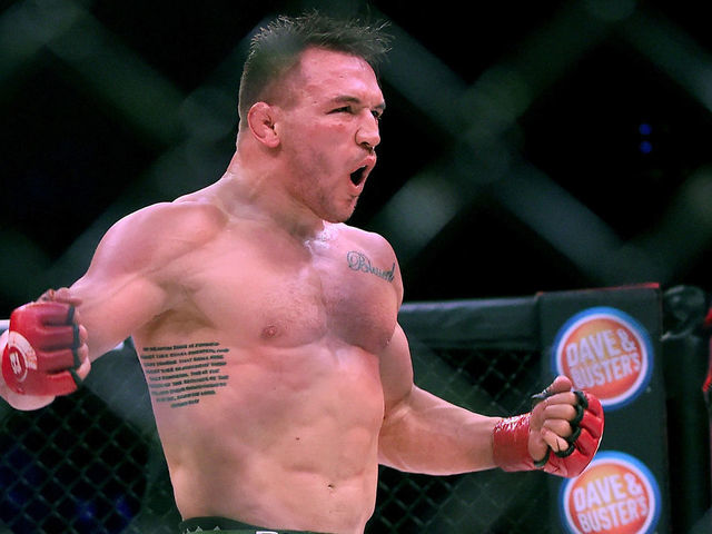 INGLEWOOD, CA - JANUARY 20: Michael Chandler Jr (red gloves) celebrates after defeating Goiti Yamauchi (blue gloves) in their Lightweight fight at Bellator 192 at The Forum on January 20, 2018 in Inglewood, California. Michael Chandler Jr won by unanimous decision.