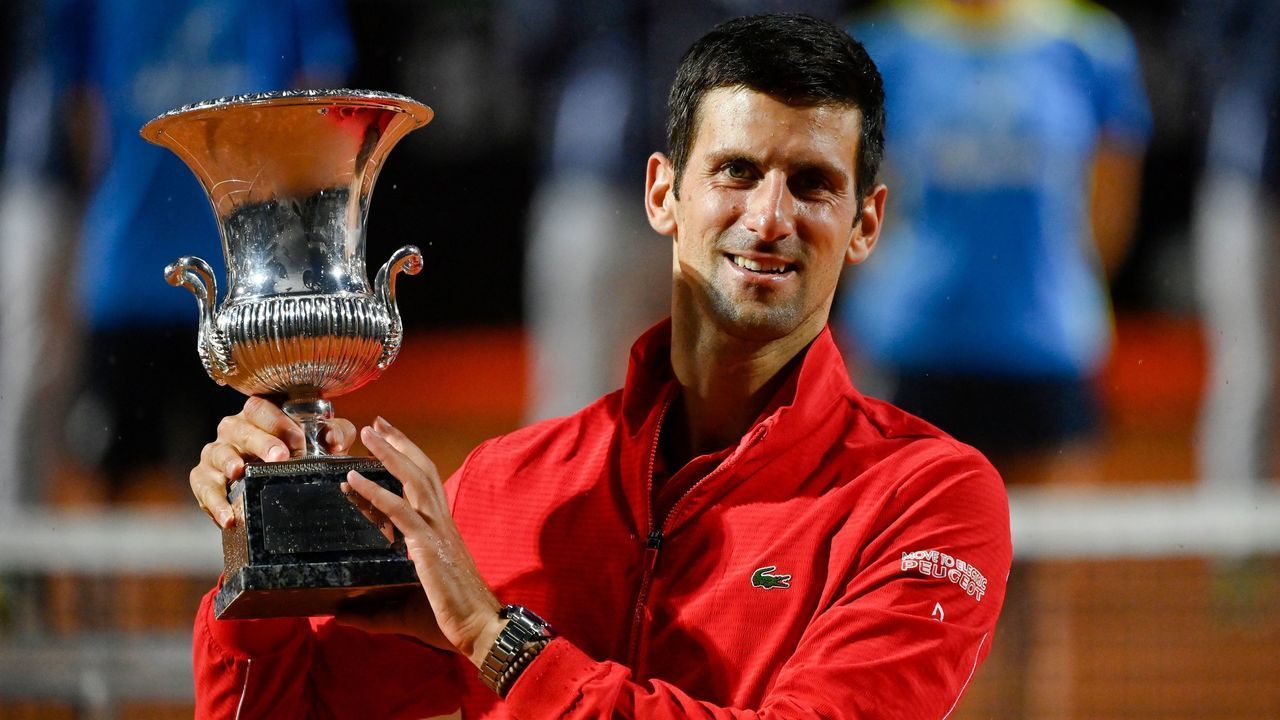 Serbia's Novak Djokovic poses with his trophy after winning the final match of the Men's Italian Open against Argentina's Diego Schwartzman at Foro Italico on September 21, 2020 in Rome, Italy.