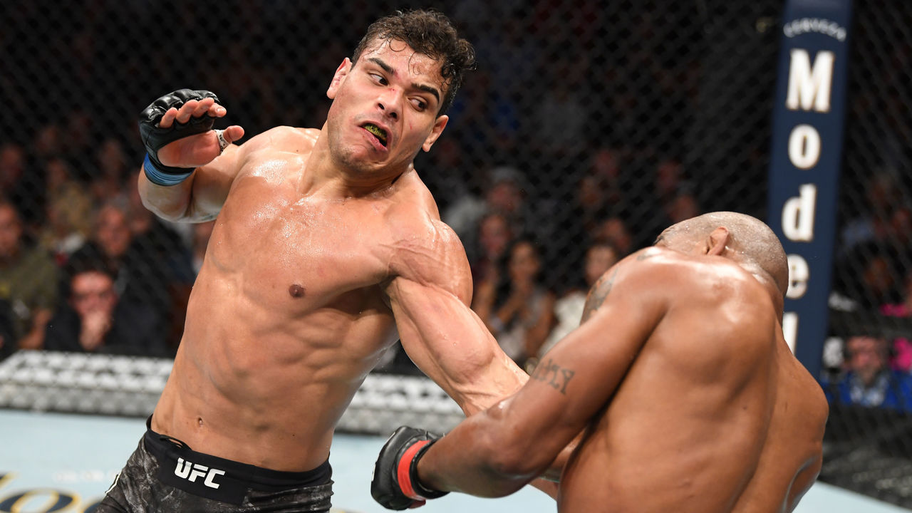 ANAHEIM, CALIFORNIA - AUGUST 17: (L-R) Paulo Costa of Brazil punches Yoel Romero of Cuba in their middleweight bout during the UFC 241 event at the Honda Center on August 17, 2019 in Anaheim, California.