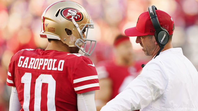 SANTA CLARA, CALIFORNIA - JANUARY 11: Jimmy Garoppolo #10 speaks with head coach Kyle Shanahan of the San Francisco 49ers during the NFC Divisional Round Playoff game against the Minnesota Vikings at Levi's Stadium on January 11, 2020 in Santa Clara, California.