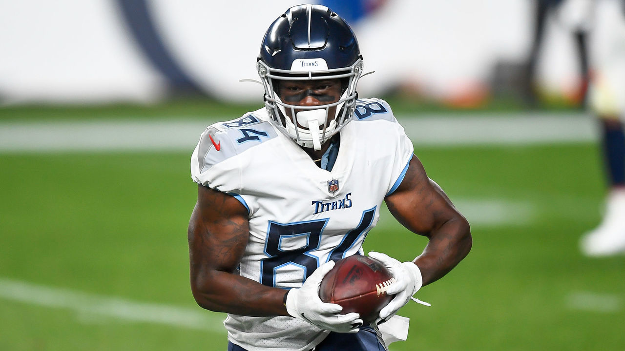 DENVER, CO - SEPTEMBER 14: Corey Davis #84 of the Tennessee Titans runs after a catch against the Denver Broncos at Empower Field at Mile High on September 14, 2020 in Denver, Colorado.