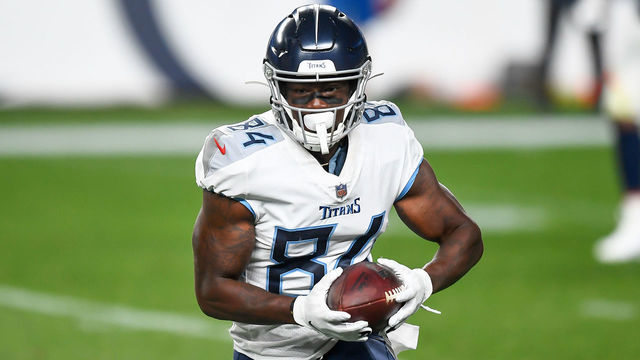 DENVER, CO - SEPTEMBER 14: Corey Davis #84 of the Tennessee Titans runs after a catch against the Denver Broncos at Empower Field at Mile High on September 14, 2020 in Denver, Colorado.
