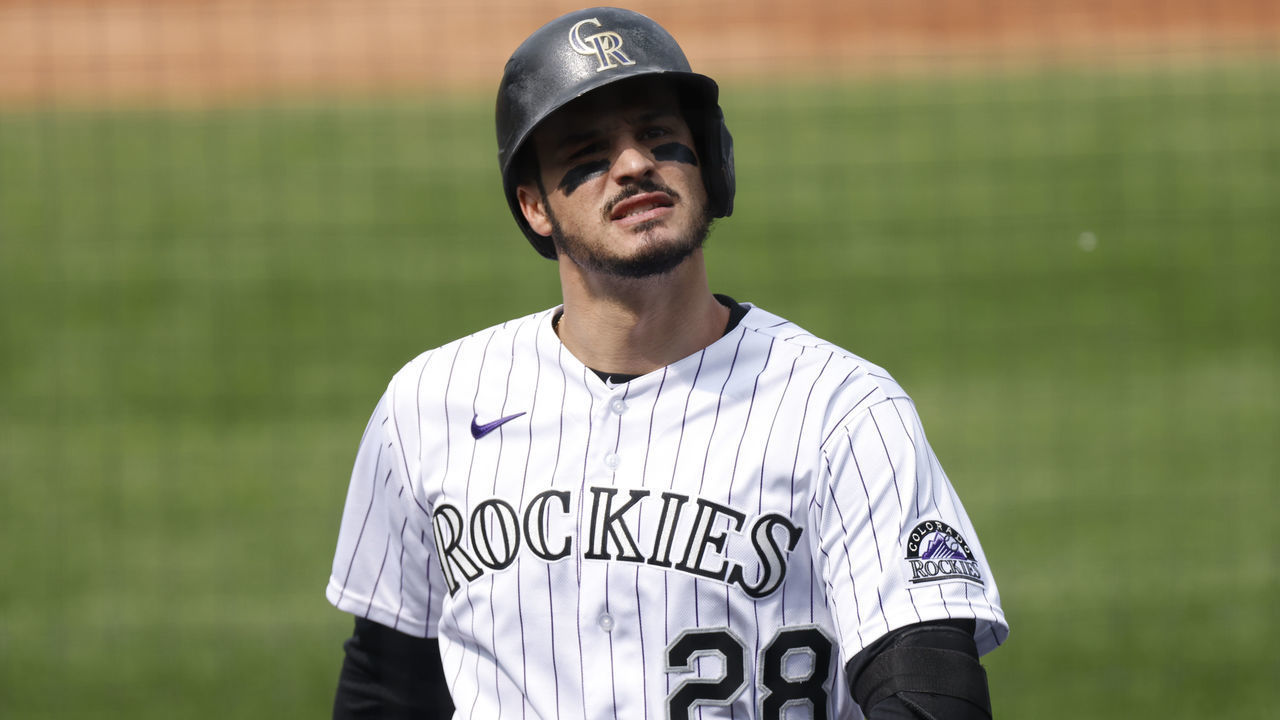 DENVER, CO - SEPTEMBER 16: Nolan Arenado #28 of the Colorado Rockies reacts while walking back to the dugout after lining out during the second inning against the Oakland Athletics at Coors Field on September 16, 2020 in Denver, Colorado.