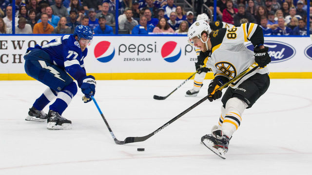 TAMPA, FL - MARCH 3: Victor Hedman #77 of the Tampa Bay Lightning skates against David Pastrnak #88 of the Boston Bruins during the second period at Amalie Arena on March 3, 2020 in Tampa, Florida.