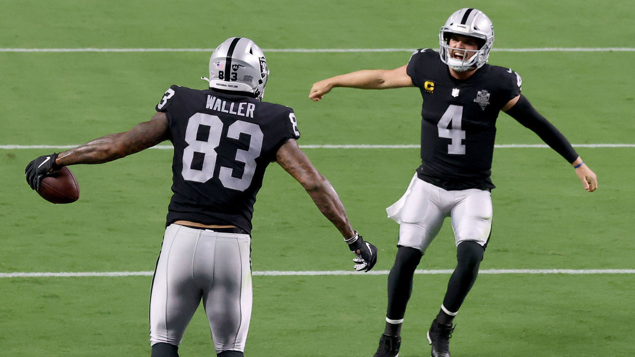 LAS VEGAS, NEVADA - SEPTEMBER 21: Darren Waller #83 of the Las Vegas Raiders celebrates a touchdown with Derek Carr #4 during the third quarter against the New Orleans Saints at Allegiant Stadium on September 21, 2020 in Las Vegas, Nevada.