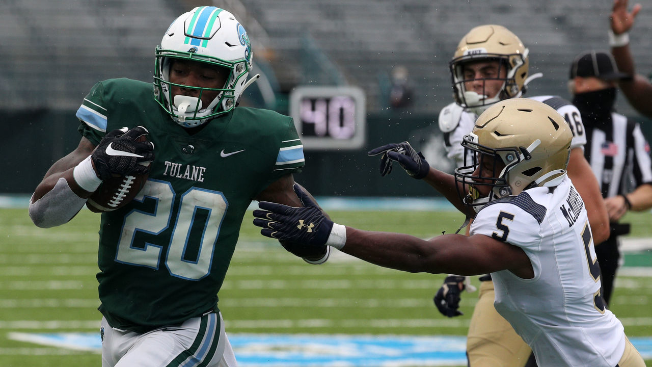 NEW ORLEANS, LOUISIANA - SEPTEMBER 19: Cameron Carroll #20 of the Tulane Green Wave runs against the Navy Midshipmen at Yulman Stadium on September 19, 2020 in New Orleans, Louisiana.