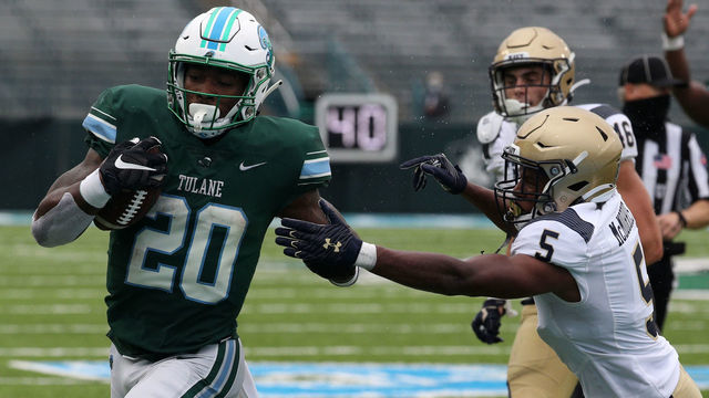 NEW ORLEANS, LOUISIANA - SEPTEMBER 19: Cameron Carroll #20 of the Tulane Green Wave runs against the Navy Midshipmen at Yulman Stadium on September 19, 2020 in New Orleans, Louisiana.