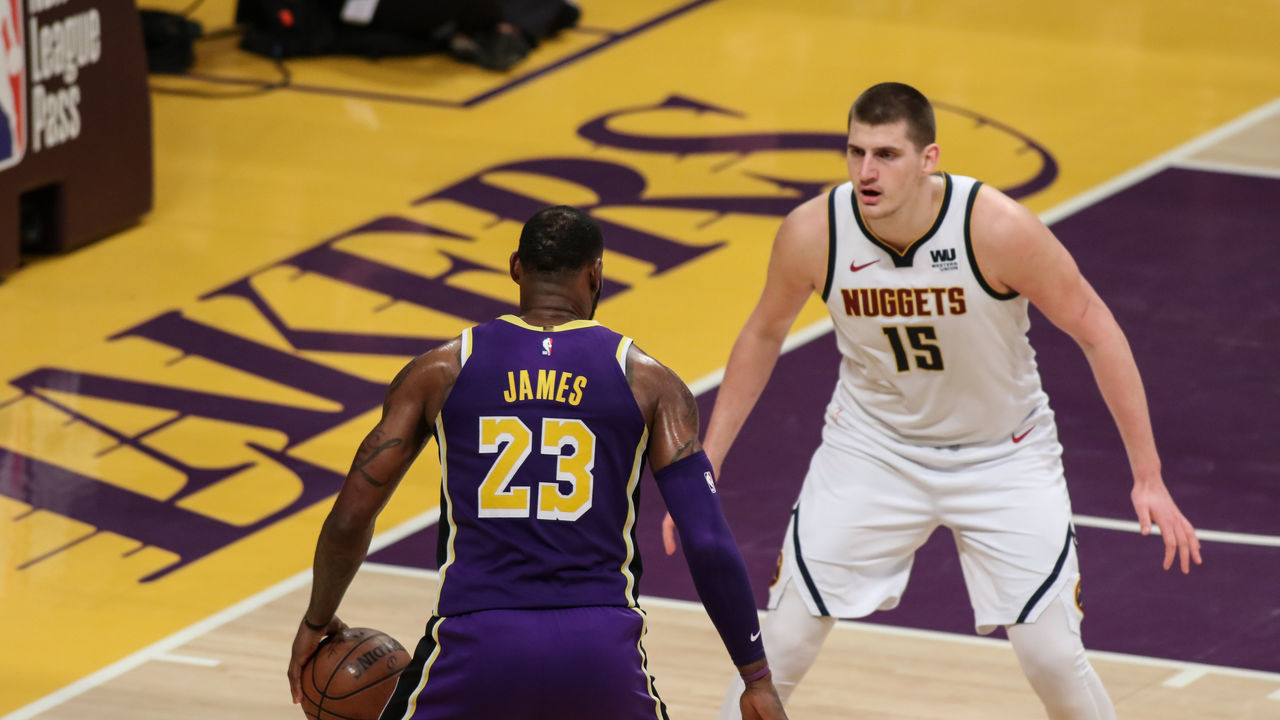 LOS ANGELES, CA - MARCH 06: Los Angeles Lakers Forward LeBron James (23) being guarded by Denver Nuggets Center Nikola Jokic (15) during the Denver Nuggets game versus the Los Angeles Lakers on March 6, 2019, at Staples Center in Los Angeles, CA.