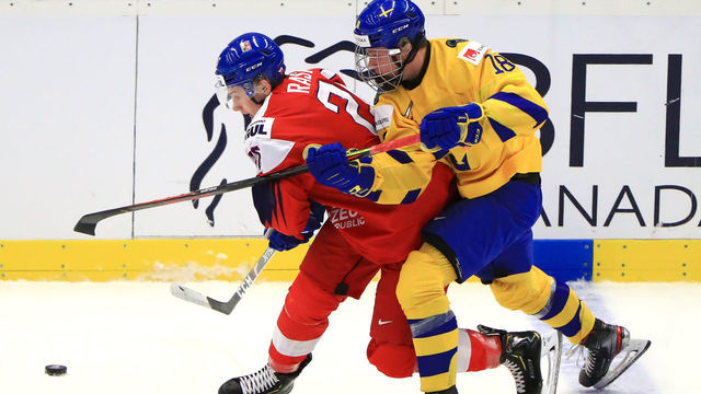 OSTRAVA, CZECH REPUBLIC - JANUARY 2, 2020: The Czech Republics Adam Raska (L) and Swedens Lucas Raymond in their 2020 IIHF World Junior Ice Hockey Championship quarter-final match at Ostravar Arena. Peter Kovalev/TASS
