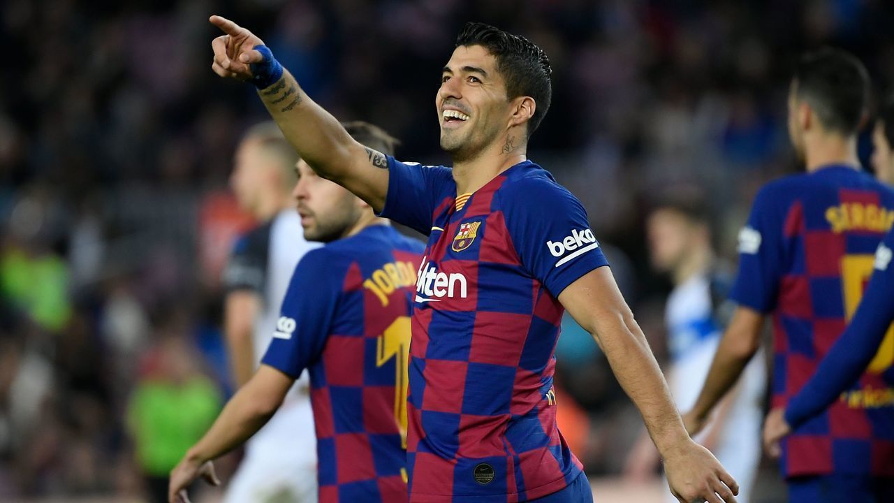 Barcelona's Uruguayan forward Luis Suarez celebrates after scoring a goal during the Spanish league football match FC Barcelona against Deportivo Alaves at the Camp Nou stadium in Barcelona on December 21, 2019.