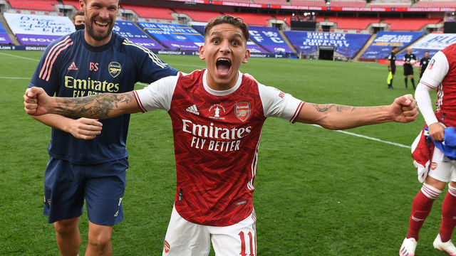 LONDON, ENGLAND - AUGUST 01: Lucas Torreira and Arsenal Fitness coach Barry Solan after the FA Cup Final match between Arsenal and Chelsea at Wembley Stadium on August 01, 2020 in London, England. Football Stadiums around Europe remain empty due to the Coronavirus Pandemic as Government social distancing laws prohibit fans inside venues resulting in all fixtures being played behind closed doors.