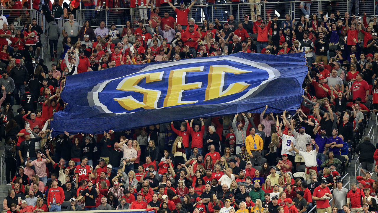 ATLANTA, GA - DECEMBER 07: Fans pass along the huge SEC flag during the SEC Championship Game between the UGA Bulldogs and the LSU Tigers on December 7, 2019 at the Mercedes-Benz Stadium in Atlanta, Georgia.