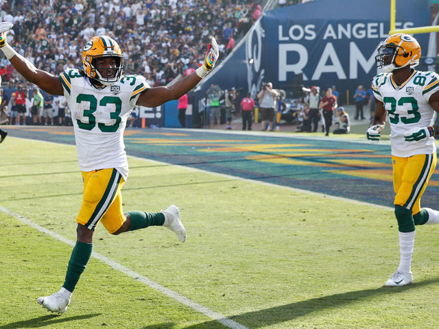 LOS ANGELES, CA - OCTOBER 28: Running back Aaron Jones #33 of the Green Bay Packers celebrates in the game against the Los Angeles Rams at Los Angeles Memorial Coliseum on October 28, 2018 in Los Angeles, California.