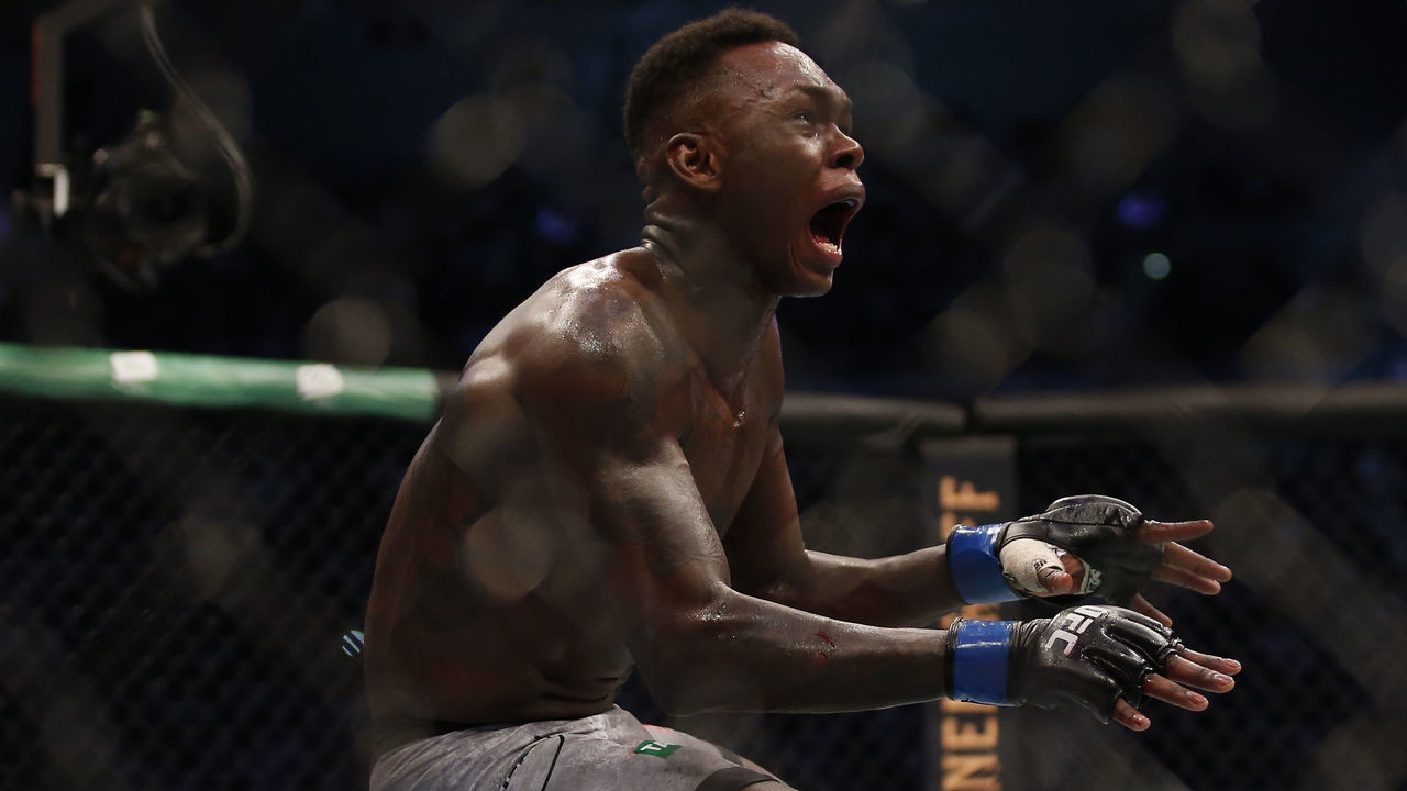 MELBOURNE, AUSTRALIA - OCTOBER 06: Israel Adesanya celebrates his victory over Robert Whittaker between in their Middleweight title bout during UFC 243 at Marvel Stadium on October 06, 2019 in Melbourne, Australia.