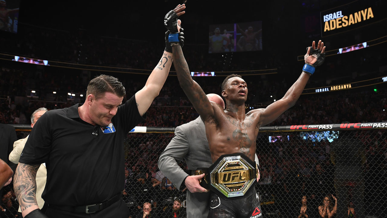 ATLANTA, GA - APRIL 13: (L-R) UFC President Dana White places the interim middleweight championship belt on Israel Adesanya after defeating Kelvin Gastelum by unanimous decision in their interim middleweight championship bout during the UFC 236 event at State Farm Arena on April 13, 2019 in Atlanta, Georgia.