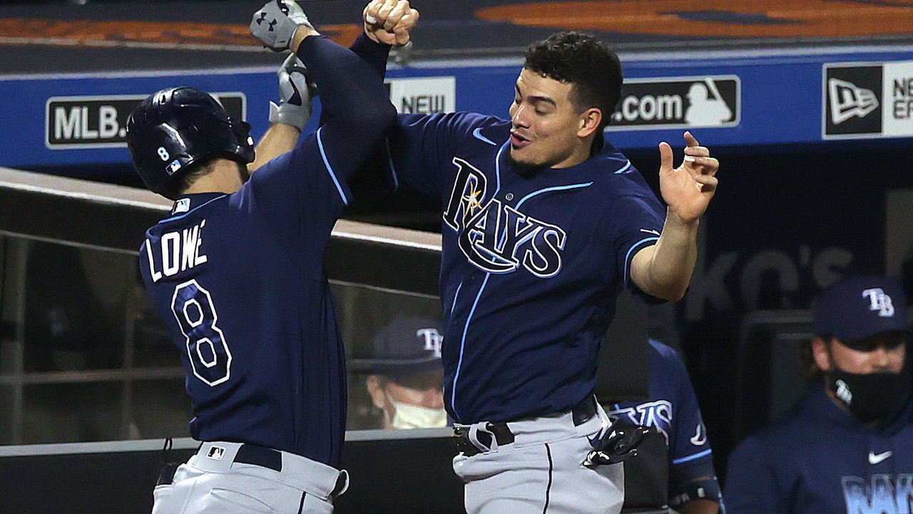 NEW YORK, NEW YORK - SEPTEMBER 23: Brandon Lowe #8 of the Tampa Bay Rays celebrates his eighth inning two run home run with Willy Adames #1 against the New York Mets during their game at Citi Field on September 23, 2020 in New York City.