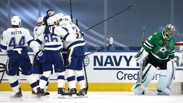 EDMONTON, ALBERTA - SEPTEMBER 23: Goaltender Anton Khudobin #35 of the Dallas Stars look son as Ondrej Palat #18 of the Tampa Bay Lightning celebrates with Kevin Shattenkirk #22, Nikita Kucherov #86, Brayden Point #21, Jan Rutta #44 and Ryan McDonagh #27 after Palat scored in the second period of Game Three of the NHL Stanley Cup Final between the Tampa Bay Lightning and the Dallas Stars at Rogers Place on September 23, 2020 in Edmonton, Alberta, Canada.
