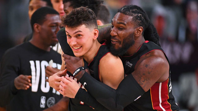 ORLANDO, FL - SEPTEMBER 23: Jae Crowder #99 and Tyler Herro #14 of the Miami Heat smile and celebrate on the court after Game Four of the Eastern Conference Finals against the Boston Celtics on September 23, 2020 in Orlando, Florida at AdventHealth Arena. NOTE TO USER: User expressly acknowledges and agrees that, by downloading and/or using this Photograph, user is consenting to the terms and conditions of the Getty Images License Agreement. Mandatory Copyright Notice: Copyright 2020 NBAE