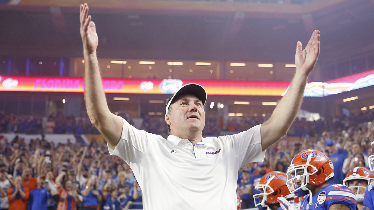 MIAMI, FLORIDA - DECEMBER 30: Head coach Dan Mullen of the Florida Gators pumps up the crowd prior to the start of the Capital One Orange Bowl against the Virginia Cavaliers at Hard Rock Stadium on December 30, 2019 in Miami, Florida.