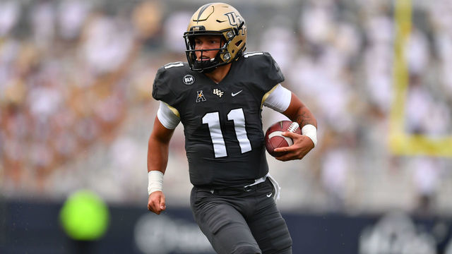 ATLANTA, GA - SEPTEMBER 19: Quarterback Dillon Gabriel #11 of the UCF Knights runs the ball upfield against the Georgia Tech Yellowjackets at Bobby Dodd Stadium on September 19, 2020 in Atlanta, Georgia. The Knights won 49-21.