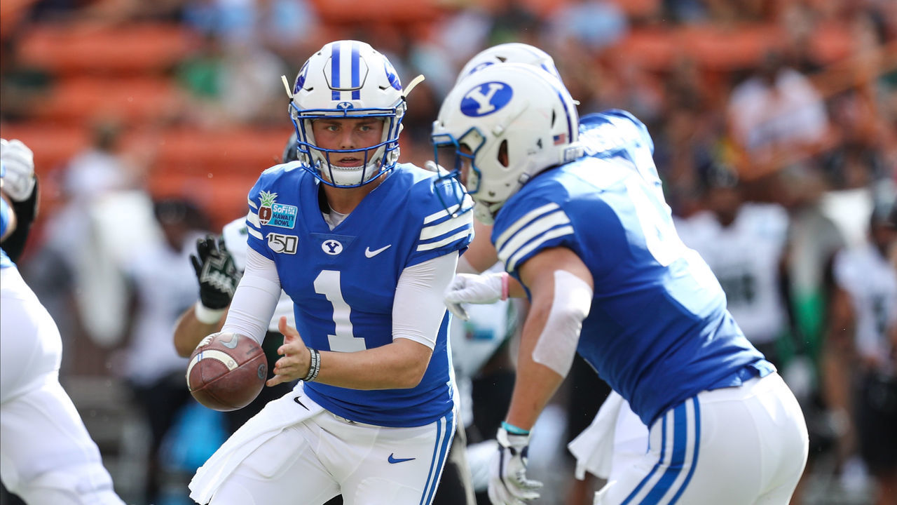 HONOLULU, HI - DECEMBER 24: Zach Wilson #1 of the BYU Cougars hands the ball off to Lopini Katoa #4 during the first quarter against the Hawaii Rainbow Warriors of the Hawai'i Bowl at Aloha Stadium on December 24, 2019 in Honolulu, Hawaii.
