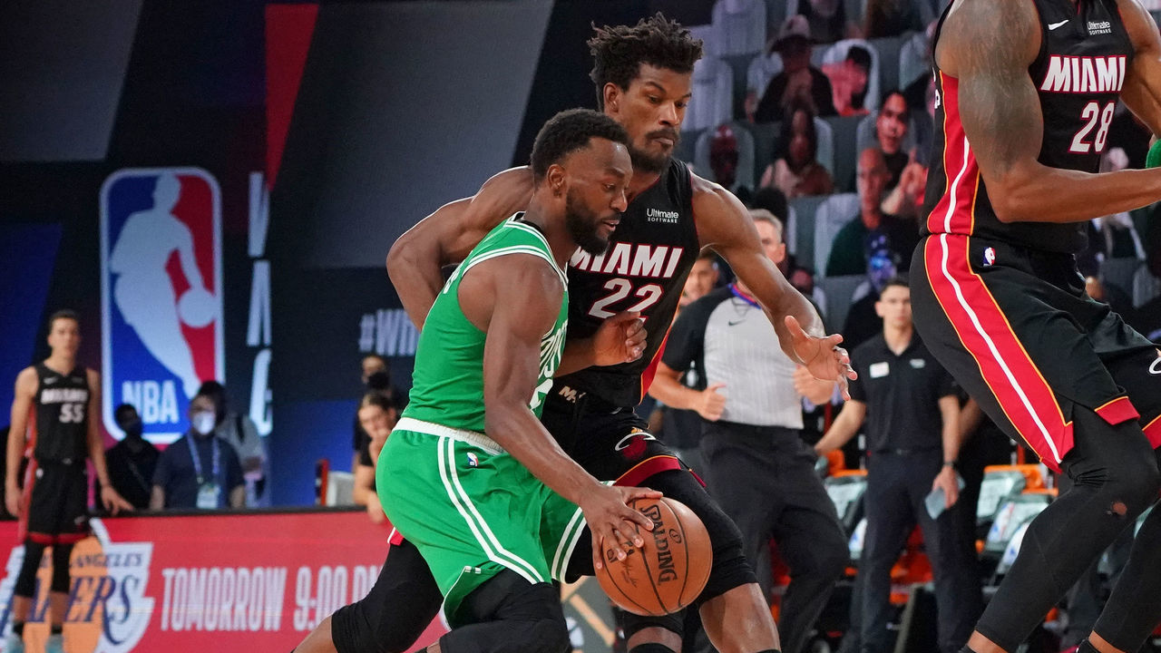 ORLANDO, FL - SEPTEMBER 23: Kemba Walker #8 of the Boston Celtics handles the ball against Jimmy Butler #22 of the Miami Heat during Game Four of the Eastern Conference Finals of the NBA Playoffs on September 23, 2020 at the AdventHealth Arena at ESPN Wide World Of Sports Complex in Orlando, Florida. NOTE TO USER: User expressly acknowledges and agrees that, by downloading and/or using this Photograph, user is consenting to the terms and conditions of the Getty Images License Agreement. Mandatory Copyright Notice: Copyright 2020 NBAE