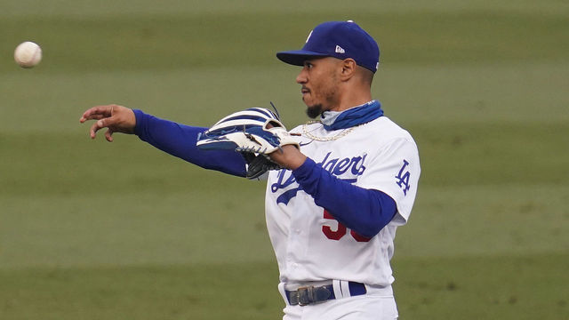 LOS ANGELES, CA - SEPTEMBER 13: Mookie Betts #50 of the Los Angeles Dodgers makes a throw while playing the Houston Astros at Dodger Stadium on September 13, 2020 in Los Angeles, California.
